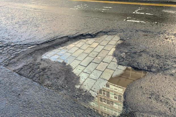 Enormous Glasgow pothole reveals original cobbled road beneath tarmac