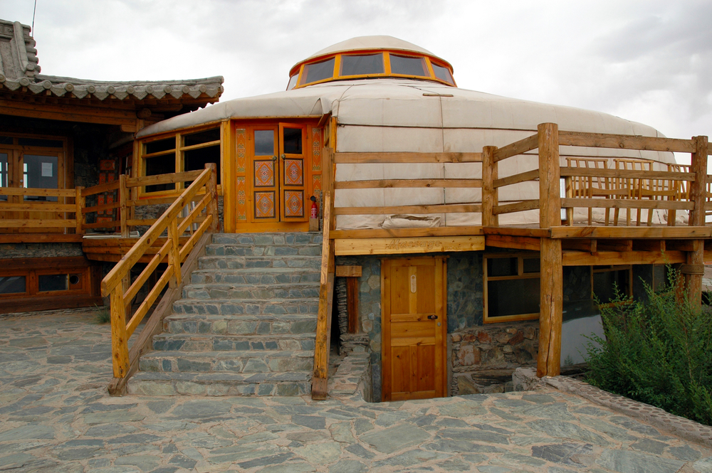 <p>Located in right next to the Gobi Altai mountains, Three Camel Lodge features <strong>35 <em>gers</em>, the yurts that are used by nomadic peoples</strong> in Mongolia. The <em>gers</em> are made from circular wood frames that are covered in furs and felts. </p>  <p>Inside, you can stay warm and cozy with wool carpets, wood stoves, camel-hair blankets, and hand-made furniture.</p>