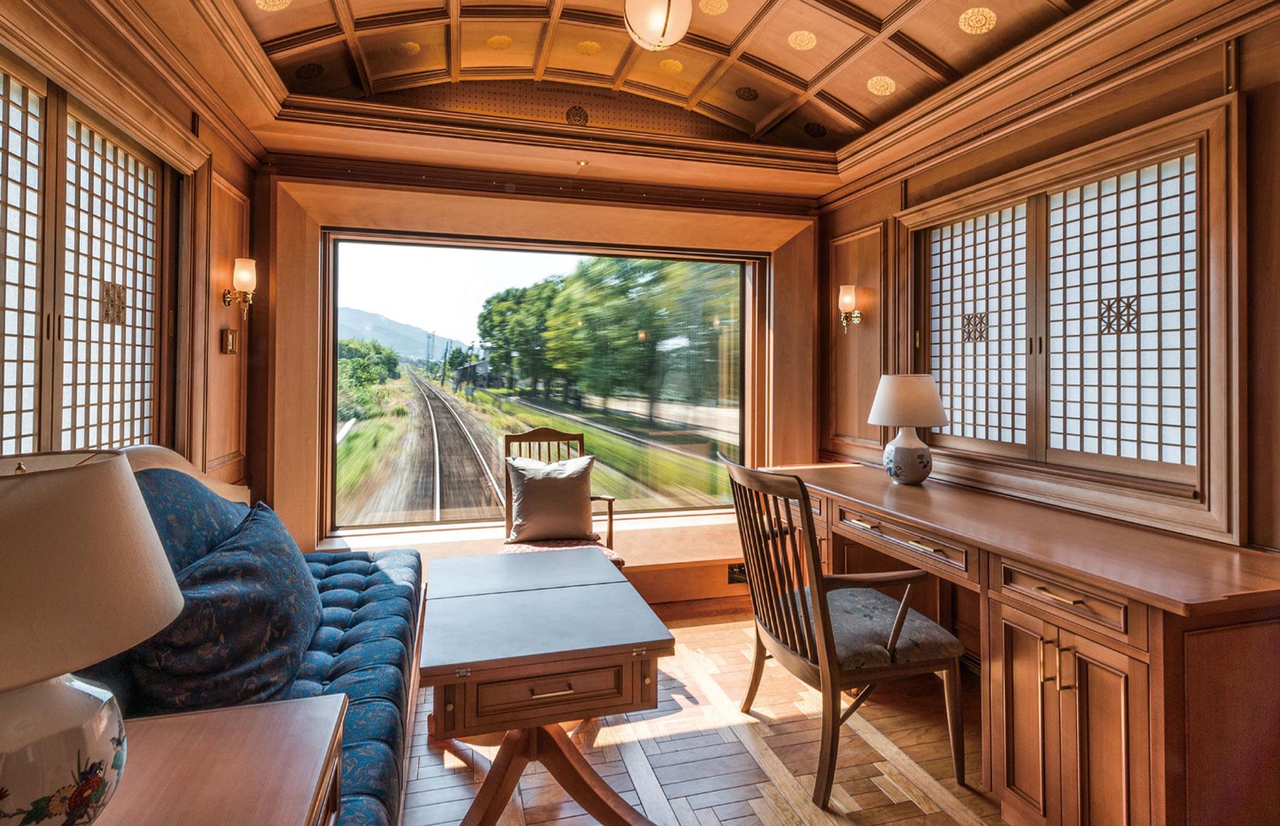 <p>A ravishing fusion of Japanese and Western design, the wood-paneled carriages include a dining car serving epicurean delights from the region, a piano lounge, and a traditional Japanese tea room.</p>  <p>The train's two Deluxe Suites are the most expensive, so naturally the hardest to secure. The larger of the pair is 226 square feet (21 square meters) and features a lounge area, sleeping area, and ensuite bathroom. But the pièce de résistance is most definitely that sensational rear window (shown here). </p>  <p>A Deluxe Suite costs 1.5 million yen per person for a two-day, one-night trip, which equates to a whopping $10,150 (£8,059).</p>