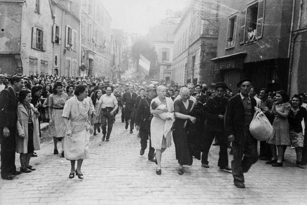 <p>Following World War II, those not on the side of the Allies or who helped the German forces were publicly shamed, particularly in Europe. To have sided with the Axis may as well have been heresy, and those that did were treated as such. </p> <p>Here, in a town in Europe, women that corroborated with the German oppressors are being marched through the streets in front of everyone. This image was taken in Charters, France.</p>