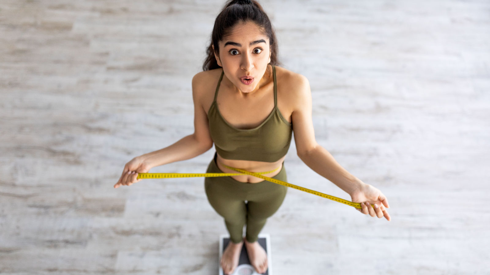image credit: prostock-studio/shutterstock <p><span>You’re eating and exercising the same, but the scale tells a different story. This unexplained weight gain, particularly around the abdomen, can be frustrating. It’s a common symptom of hormonal changes. Understanding this can help in finding the right balance in diet and exercise.</span></p>