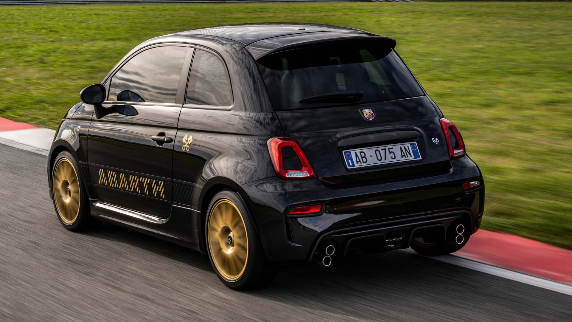 android, this abarth 695 has gold wheels and stacked exhaust tips