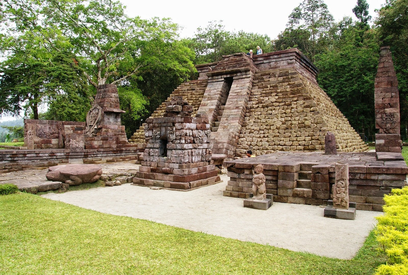 <p><span>On the slopes of Mount Lawu in Java, Indonesia, lies Candi Sukuh, a pyramid-like temple with unique Hindu-Buddhist carvings. Its terraced levels and thematic reliefs set it apart from other pyramid structures.</span></p> <p><b>Traveler’s Insight: </b><span>Explore the temple’s symbolic art, representing the human journey from worldly desires to enlightenment.</span></p> <p><b>Getting There: </b><span>Candi Sukuh is situated on the western slope of Mount Lawu, near Solo, Central Java. It’s accessible by car or motorbike from Solo or Yogyakarta.</span></p> <p><b>Things to Consider: </b><span>The temple is less touristy, so it’s a peaceful visit. However, the path can be steep and slippery, especially during the rainy season, so wear appropriate footwear.</span></p>
