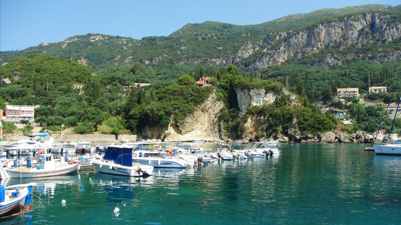 <p>Next stop: Corfu! Paleokastritsa is three bays sitting one next to another on the Greek island of Corfu. They are known for their crystal clear but cold waters and beautiful bars.</p>