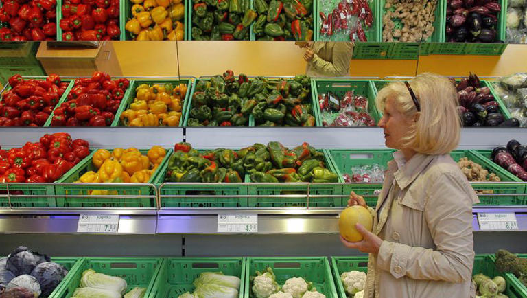 A woman chooses vegetables in a store for organic products in Munich, southern Germany, on Thursday, Aug. 9, 2007.