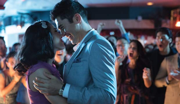 <p>The one truly wacky thing about “Crazy Rich Asians” is the response of Rachel (Constance Wu), a New York economics professor, when she travels to Singapore with her boyfriend Nick (Henry Golding) and discovers that his local family is insanely wealthy: she’s outraged. Oh, well, all good movies must have conflict and she has a good reason for being miffed. If Rachel and Nick ever tie the knot, his family expects him to live in Singapore so he can chair the family biz. Nick never told Rachel she might have to give up Balducci’s, Greenwich Village boutiques and her prestigious job someday. Worse, Nick’s mom is a real dragon who doesn’t like Rachel one bit. Happily, “Crazy Rich Asians” is a comedy that’s a hoot to watch and it inevitably wins your – and the dragon’s — heart.</p>