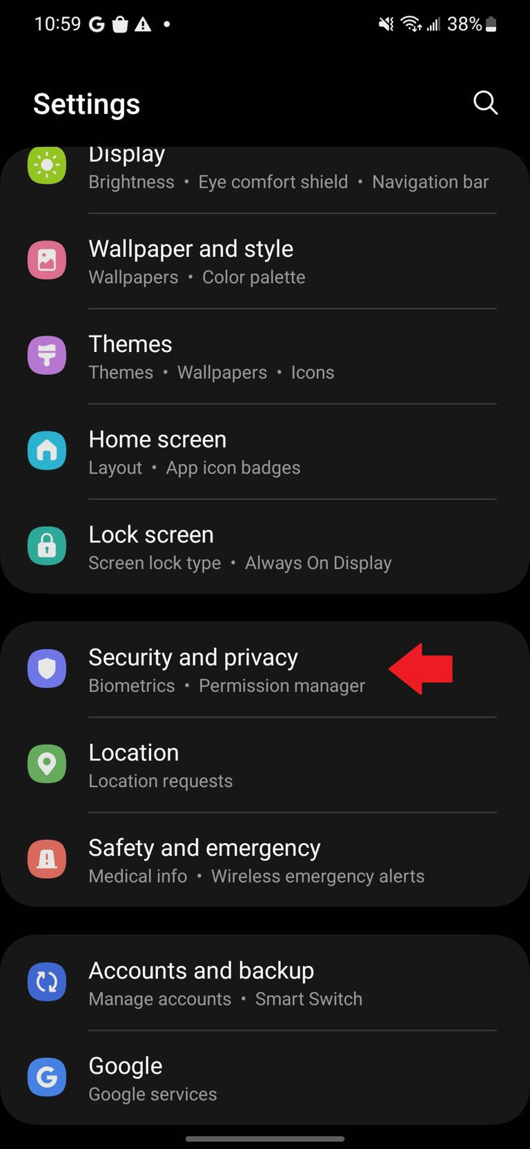 The Samsung Settings app with a red arrow pointing to the Security and privacy option