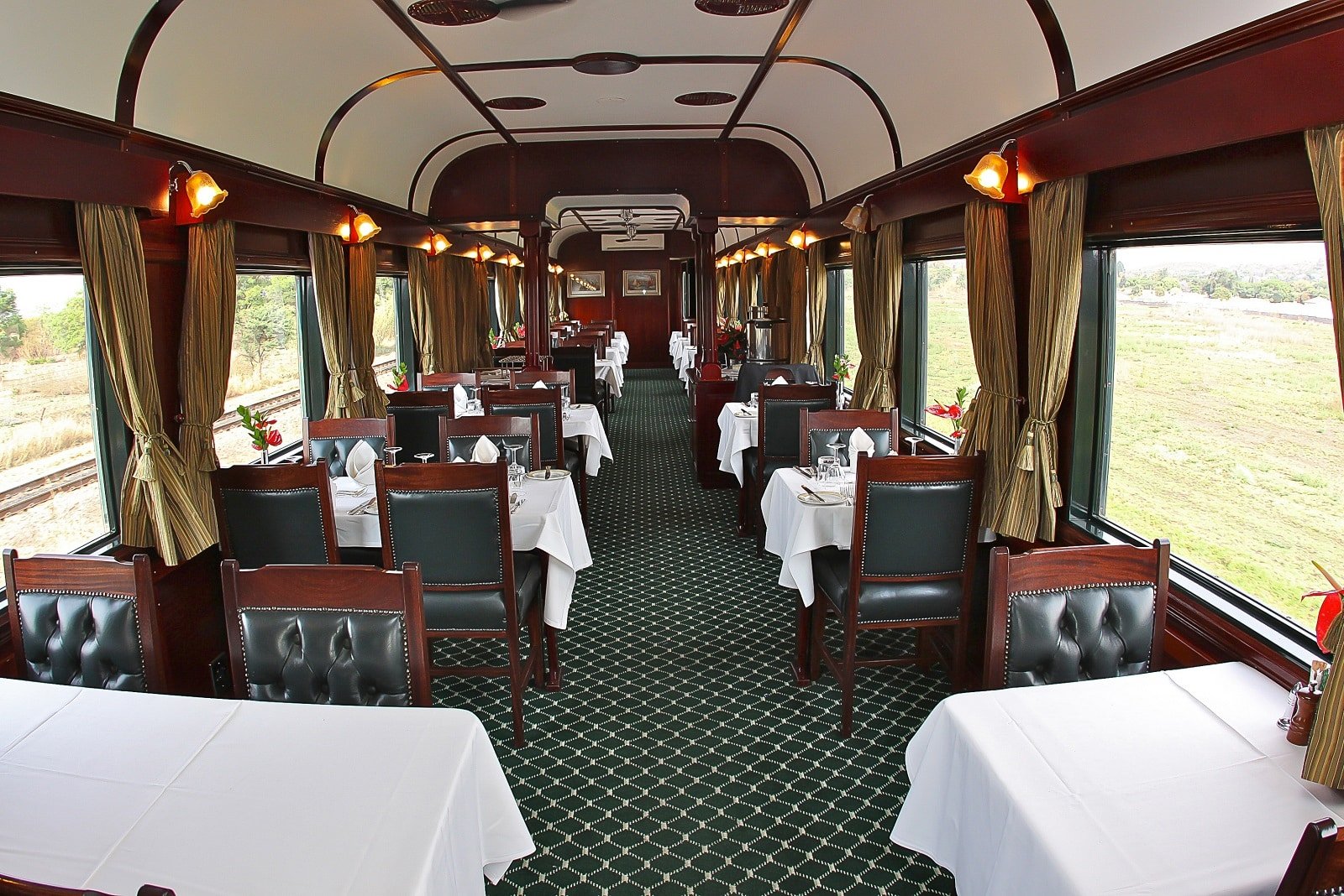 <p><span>Embark on an African adventure with Rovos Rail. Known as the “Pride of Africa,” this luxury train offers various journeys across South Africa, Zimbabwe, Namibia, and beyond. Experience the romance of a bygone era in wood-paneled coaches, with fine dining and elegant accommodations.</span></p> <p><b>Insider’s Tip: </b><span>Take the Cape Town to Dar es Salaam journey for an epic African rail experience.</span></p> <p><b>Best Time to Go: </b><span>May to September for cooler weather and excellent wildlife viewing in the game reserves.</span></p> <p><b>Highlight of the Journey: </b><span>The trip across the Karoo Desert and the stop at the historic village of Matjiesfontein.</span></p>