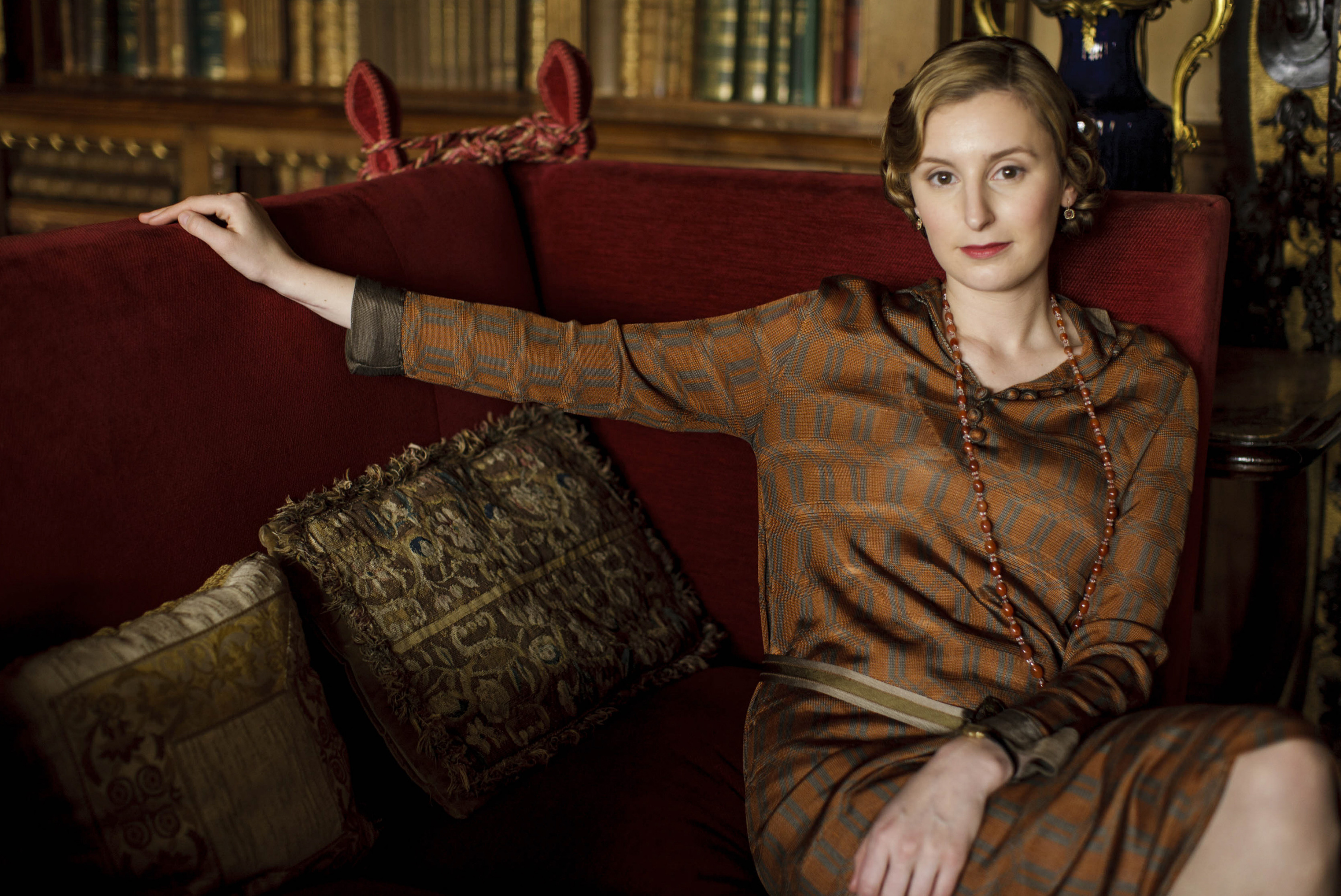 <p>Lady Edith (played by Laura Carmichael) is seen here on season 5 of "Downton Abbey" in a patterned orange and green-brown dress. "I think that [Edith] can be quite edgy and quite alternative and she wears interesting colors," costume designer Anna Mary Scott Robbins told PBS. "Laura's got an incredible complexion and I can put peach and orange and greens on her, autumnal colors that look just wonderful. She can wear a soft palette and a strong palette equally as well so her wardrobe's very varied."</p>