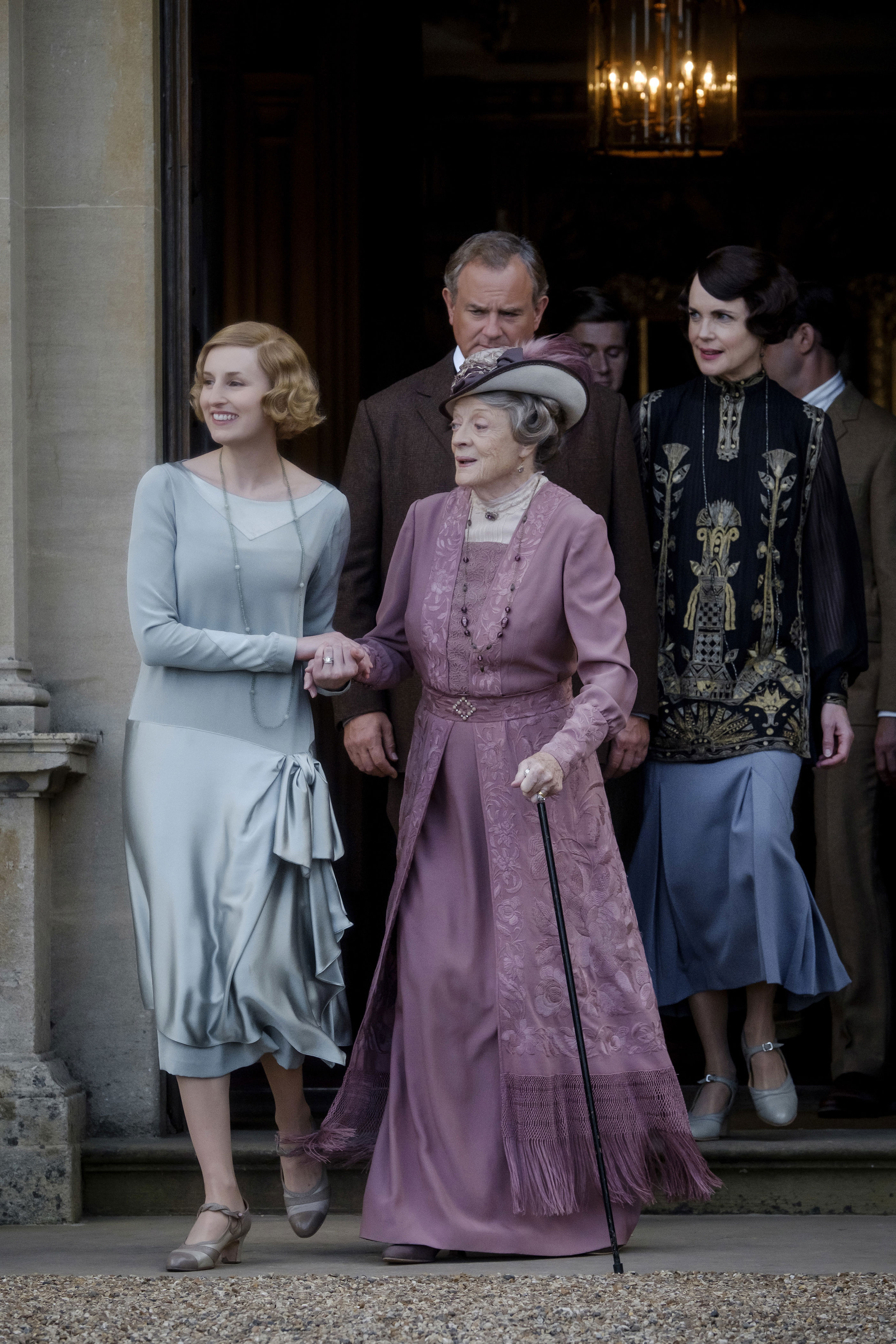 <p>While Laura Carmichael (as Lady Edith), Maggie Smith (as the Dowager Lady Grantham) and Hugh Bonneville (as Lord Grantham) were certainly dressed to impress in this scene from the 2019 "Downton Abbey" movie, it was Elizabeth McGovern (as Lady Grantham) whose look really caught the eye. "I found this silk tulle scarf with the most amazing deco embroidery in metallic thread and normal silk thread," costume designer Anna Mary Scott Robbins told <a href="https://fashionista.com/2019/09/downton-abbey-movie-costumes">Fashionista</a>. "The colors are gorgeous. She wears very intricate blouses, so I turned this scarf [into a top]."</p>
