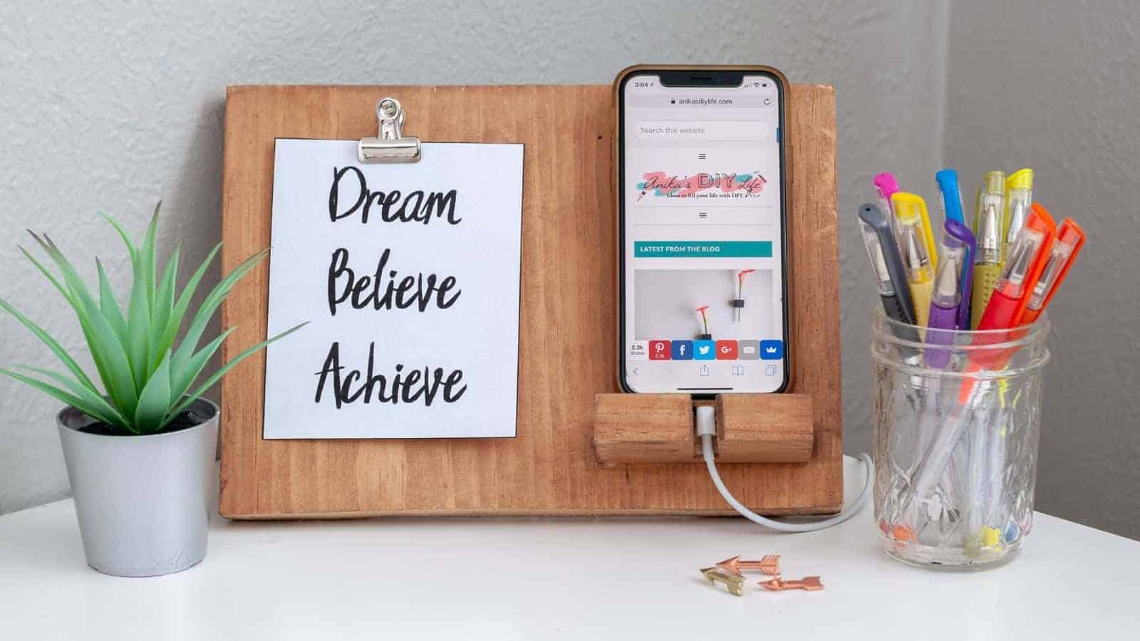<p>If you have scrap wood, you can make this DIY phone stand. There’s a place for your favorite inspirational quote or photo, and it makes the perfect desk accessory. Make one for yourself or give it as a gift. <a href="https://www.anikasdiylife.com/diy-phone-holder-photo-display/">Learn how to build this project here.</a></p>