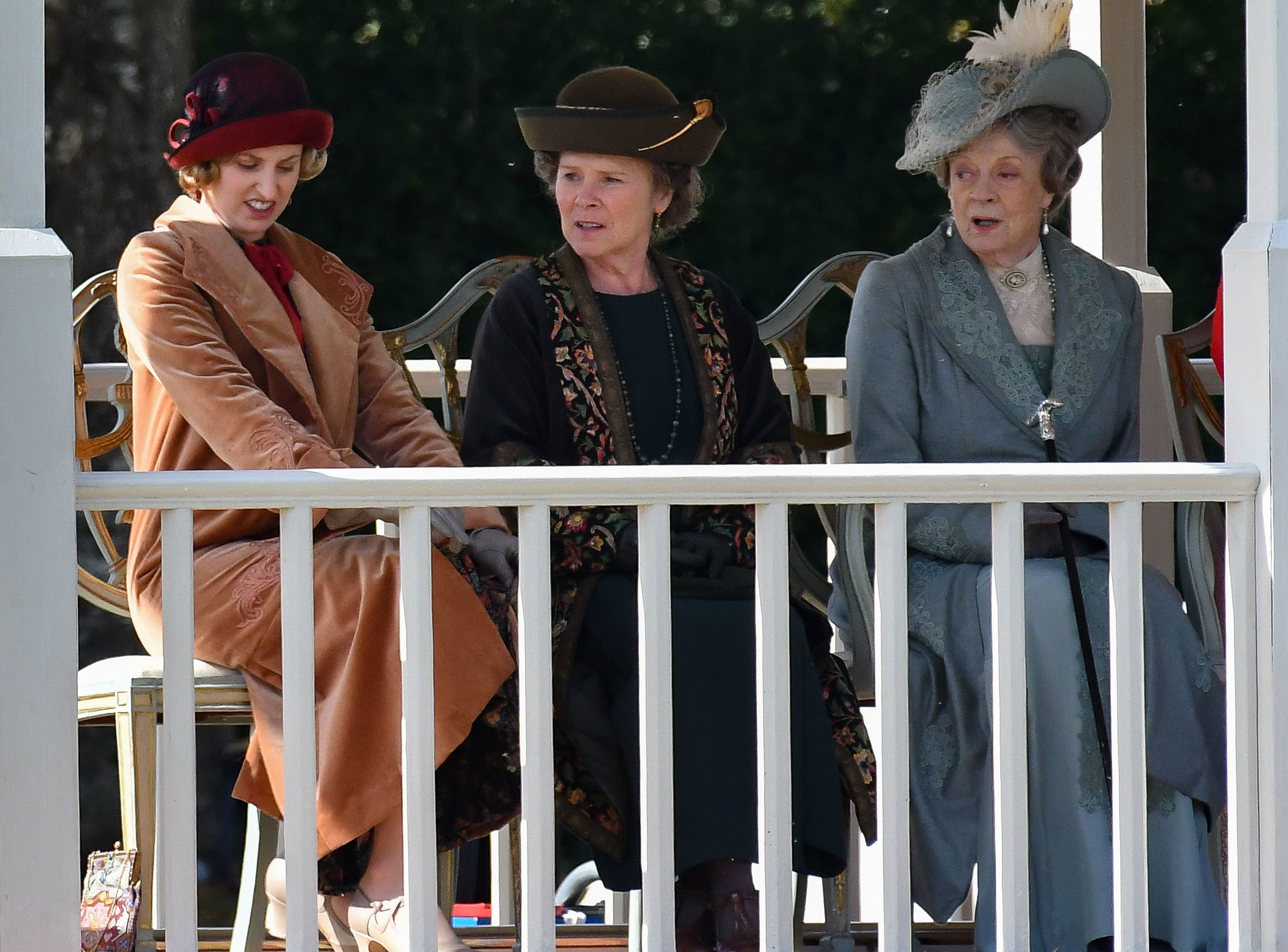 <p>Here's a peek at more of the costumes worn by Laura Carmichael (as Lady Edith), Imelda Staunton (as Maud, Baroness Bagshaw -- a Crawley cousin and lady-in-waiting to Queen Mary) and Maggie Smith (as Violet Crawley, Dowager Countess of Grantham) as they filmed the "Downton Abbey" movie in Wiltshire, England, in 2018. Fun fact: In real life, Imelda is married to Jim Carter, who plays retired butler Charles Carson in the franchise.</p>