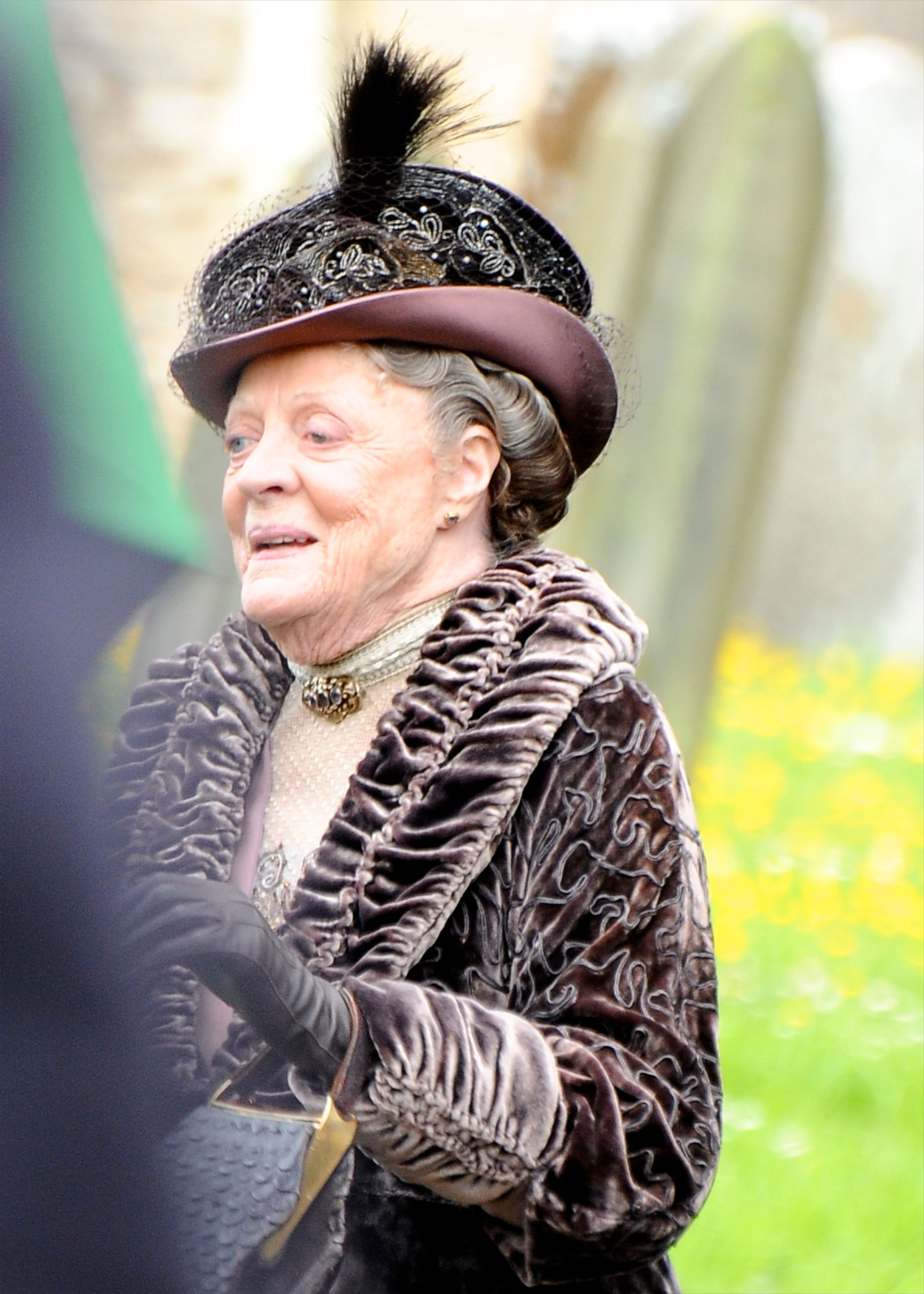 <p>Here's a closer look at the detail on one of the hats and jackets that Maggie Smith (as the Dowager Countess of Grantham) wore while shooting "Downton Abbey" in 2013. Although costume designer Anna Mary Scott Robbins didn't join the production until season 5, she still has some strong thoughts about the older aristocrat's wardrobe. "Lady Violet will be corseted until the end of time," she told <a href="https://www.vogue.co.uk/article/downton-abbey-film-costumes-anna-jones-interview">Vogue</a>. "She's always going to have an Edwardian silhouette."</p>