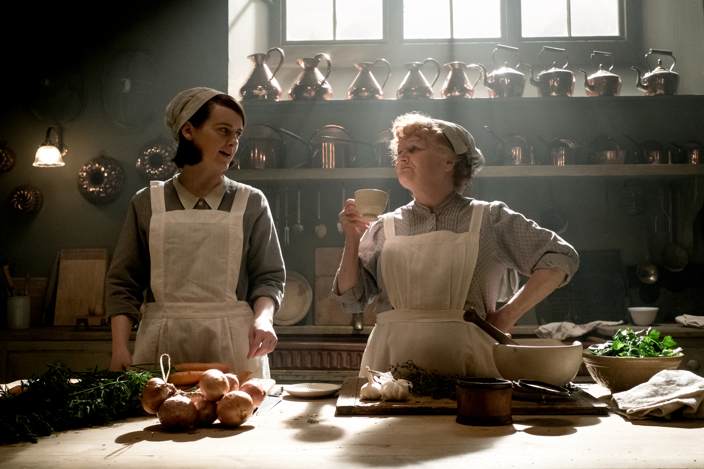 <p>Downton Abbey's cook, Mrs. Patmore (Lesley Nicol, right), is seen here in uniform alongside kitchen maid-turned-assistant cook Daisy Mason (played by Sophie McShera) on a poster for the "Downton Abbey" film. "Leslie, Mrs. Patmore, has had the same cap for six years," costume designer Anna Mary Scott Robbins told <a href="https://fashionista.com/2019/09/downton-abbey-movie-costumes">Fashionista</a>. "I offered to make her a new one [for the movie] and she said, 'No, no, this is my cap. I need my cap.' So there are certain things that are favorites and that's the way it should be."</p>
