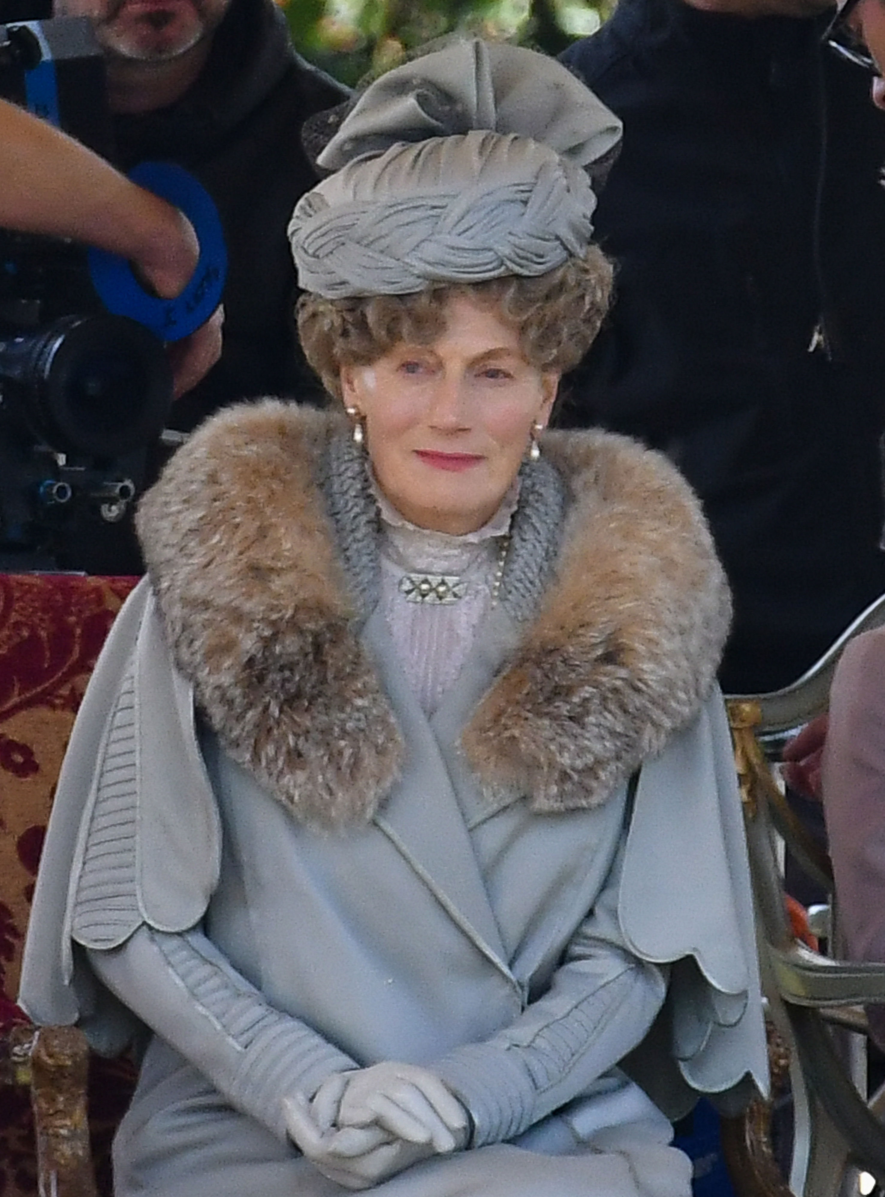 <p>Geraldine James -- seen here during filming in Wiltshire, England, in 2018 -- played Britain's Queen Mary (the current Queen Elizabeth II's grandmother) in the "Downton Abbey" movie. The film's costume designer told <a href="https://ew.com/movies/2019/09/13/downton-abbey-movie-costumes/">Entertainment Weekly</a> that she worked with John Bright at London's Cosprop, which specializes in the hire and making-to-hire of period costume for professional stage, TV and film productions, on the movie and that he really delivered when it came to the monarch's wife. "John has some pieces of Queen Mary's actual wardrobe in his archives that we were able to analyze to look at the construction and detail," Anna Mary Scott Robbins told EW, adding that one of the dresses crafted for Geraldine was made with fabric once worn by the real royal.</p>