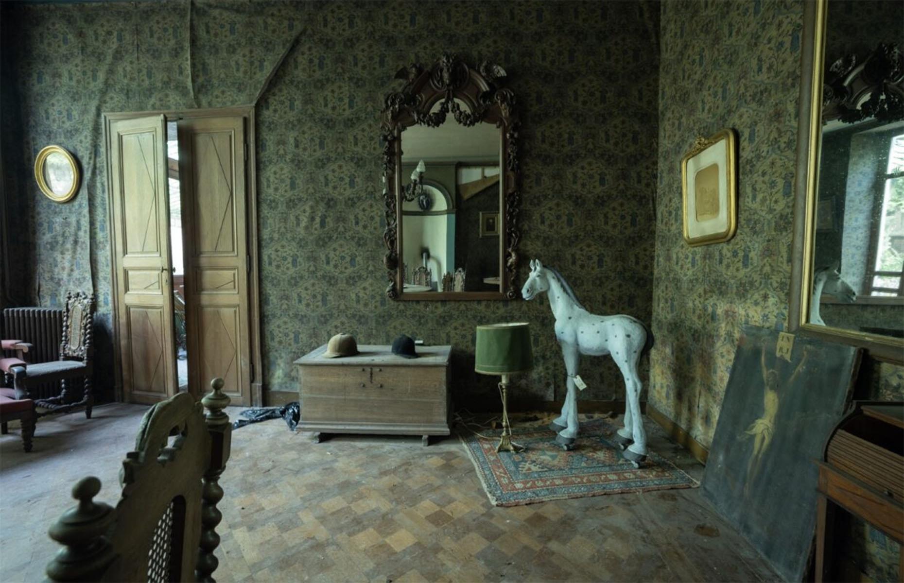 <p>With parquet flooring, damask-clad walls, and heavily gilded mirrors, this home was clearly once designed for a very wealthy family.</p>  <p>With so many expensive treasures still within, including intricately carved wooden furniture and valuable antiques, it’s miraculous that the property has been spared by looters over the years.</p>