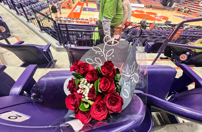 Clemson forward PJ Hall leaves a dozen roses for his mother at her seat two hours before the basketball game with Miami at Littlejohn Coliseum on Valentine's Day, Wednesday, February 14, 2024.