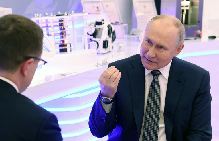 Russia's President Vladimir Putin gives an interview to journalist Pavel Zarubin (via REUTERS)