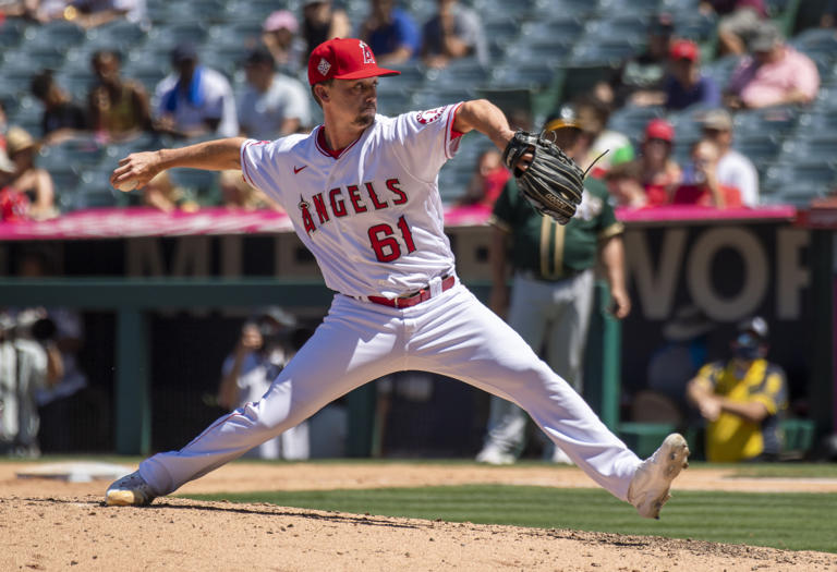 Austin Warren (61) of the Angels pitches against the A’s in the 5th inning in a game at Angel Stadium in Anaheim on Sunday, Aug. 1, 2021.