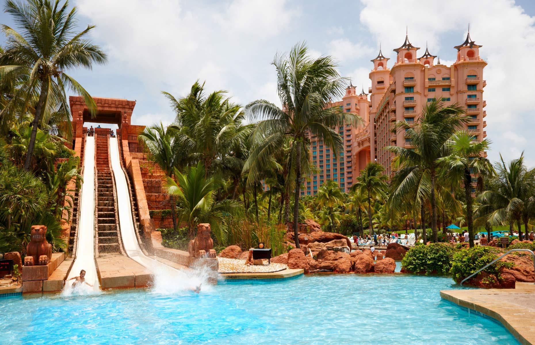 <p>Designed with a Maya civilisation theme, Aquaventure Waterpark is surrounded by tropical greenery and part of the hotel Atlantis, Paradise Island. Launch yourself from the top of the Mayan Temple on the Leap of Faith (pictured) to drop down a near vertical clear tunnel at high speed, shooting through a shark-filled tank. Or twist and turn around the temple's dark core on the Serpent Slide. The sedate Jungle Slide takes children on a watery safari through jungles and caves. They'll also love firing the water cannons in the play fort.</p>