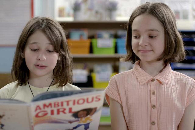Paramount+ / MTV Documentary Films Two students read 'Ambitious Girl' by Meena Harris in the documentary 'The ABCs of Book Banning'