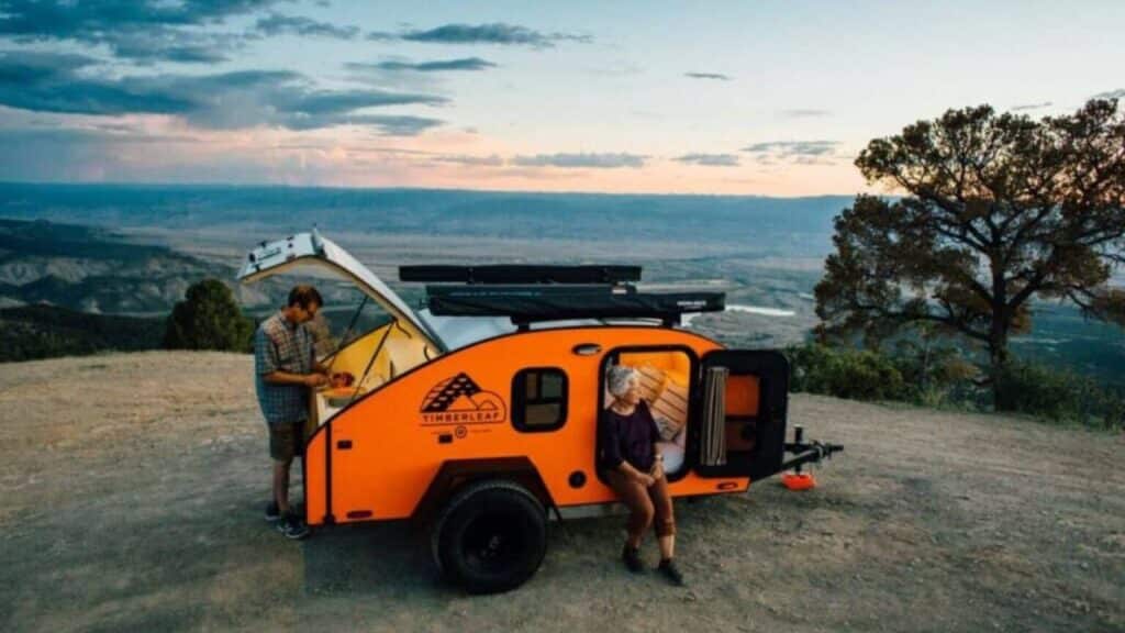 <p>The Timberleaf Classic <a href="https://www.thewaywardhome.com/teardrop-camper-interior/">Teardrop Camper</a> has a cute, eye-catching design that makes it an obvious choice for our list. But what sets this trailer apart from the competition is the fully insulated cabin. That goes a long way for extended-season camping on cooler evenings. </p><p>For someone who loves to cook on any camping trip, the rear galley offers a built-in sink, an 11 or 17.5-gallon onboard water storage tank, multiple drawers for storing <a href="https://www.thewaywardhome.com/campervan-kitchen-essentials/">kitchen essentials</a>, and options to include a two-burner cookstove, a pull-out tray for a cooler or portable fridge, and three cooler or fridge models.</p>