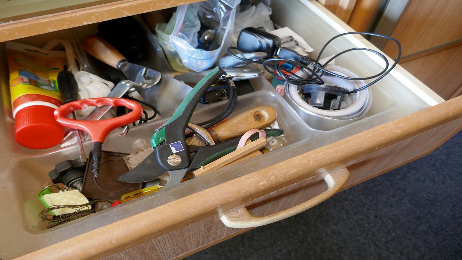 <p>All houses have a designated drawer full of miscellaneous items—the final destination for kitchen scissors, takeout menus, and random bits of string. Clear the junk drawer, wipe it down, and find everything inside a designated spot. If the item does not seem to belong anywhere, that is because it belongs in the trash.</p>
