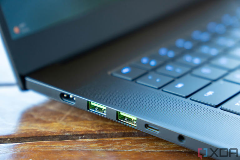 Angled view of USB ports on black laptop