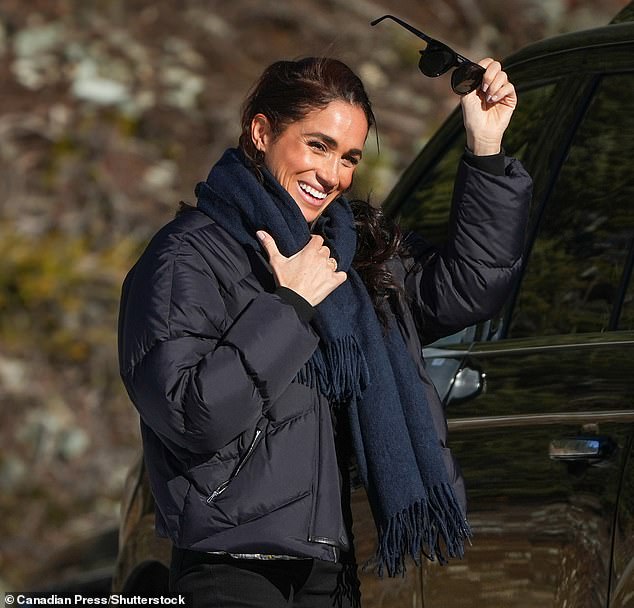 meghan markle wraps up in £3,000 hermes puffer jacket and dons £150,000 of jewellery (including her re-set engagement ring) to cheer on prince harry at the track in whistler