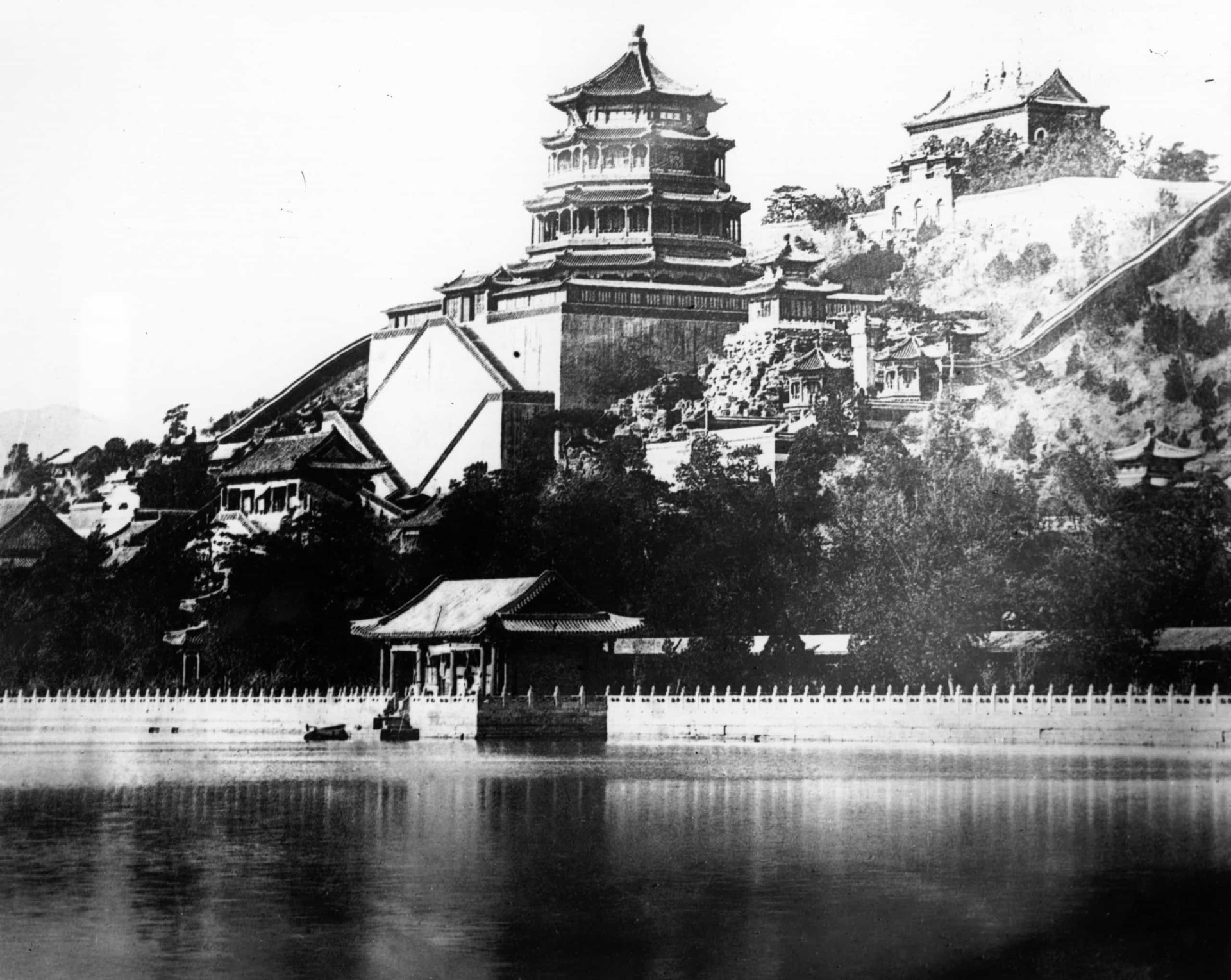 The Summer Palace looks onto the lake, located in former Peking (Beijing). It was built back in 1750, and the photo was taken roughly 100 years later.