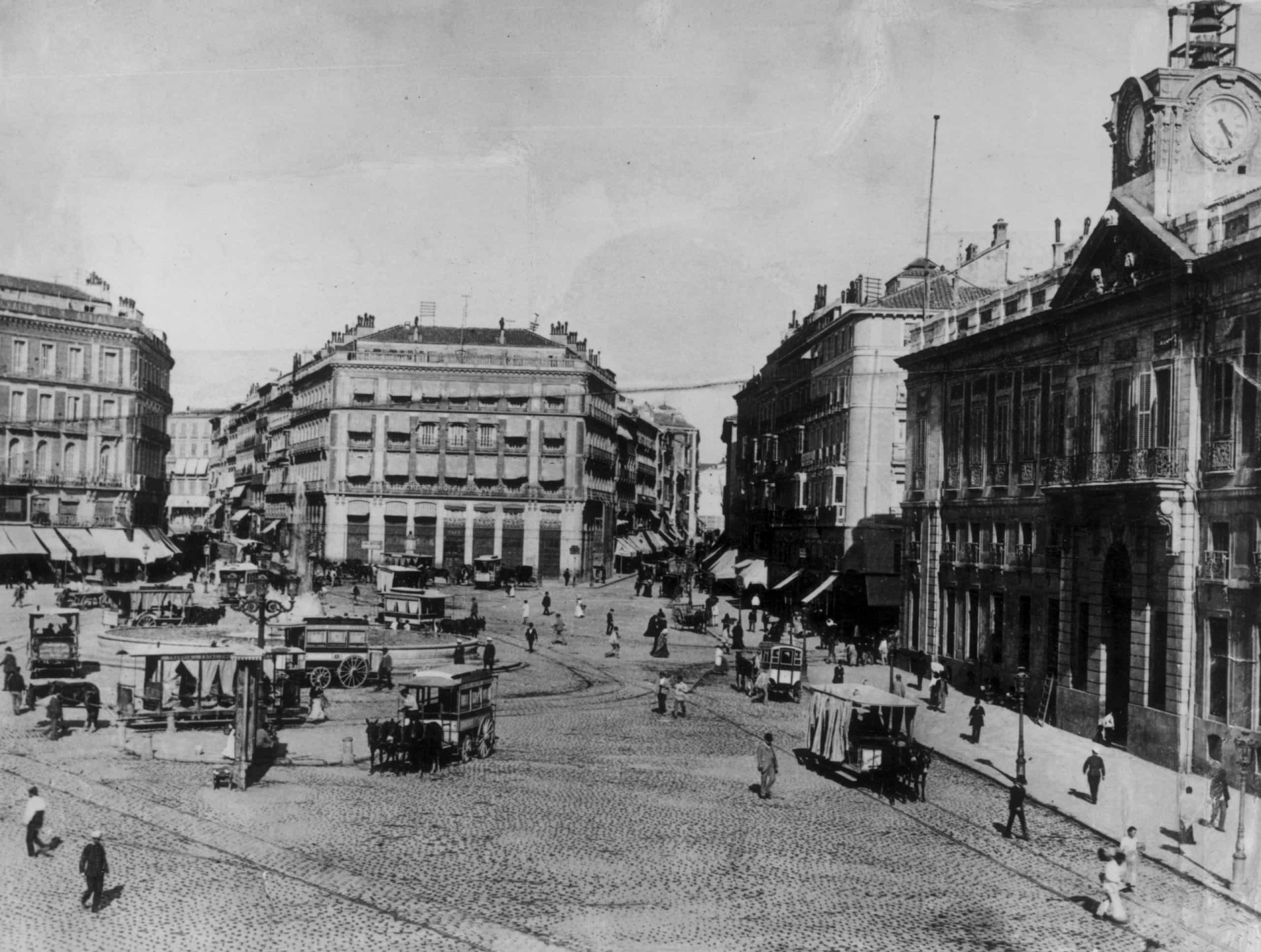 Madrileños may recognize Sol, the city's traditional center. Here are horse-drawn trams carrying goods around in 1880.
