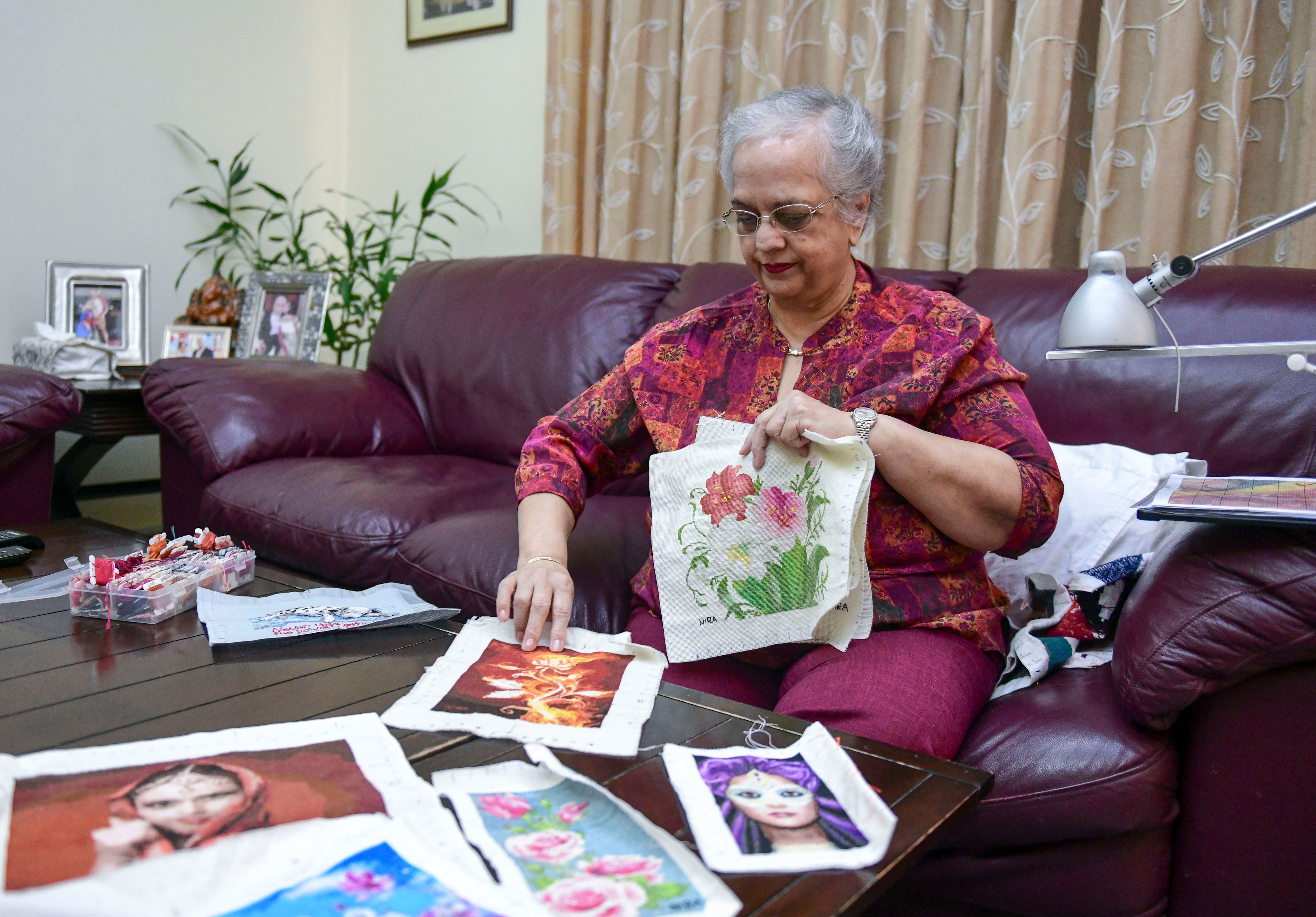 photo essay: abu dhabi artist paints pictures in cross stitches
