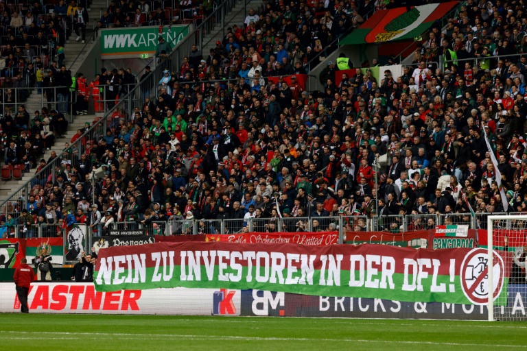 'no reason to stop': german fans vow to continue investor protests