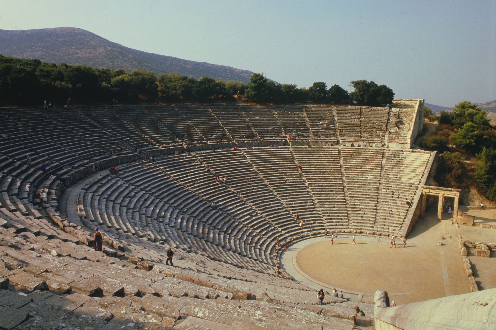 <p>The theater of Epidaurus is also one of the must-visit places in Greece. Built in the 4th century BC and remarkably preserved, the theater is still used for performances due to its beauty and excellent acoustics. The complex also includes a temple and a stadium.</p>