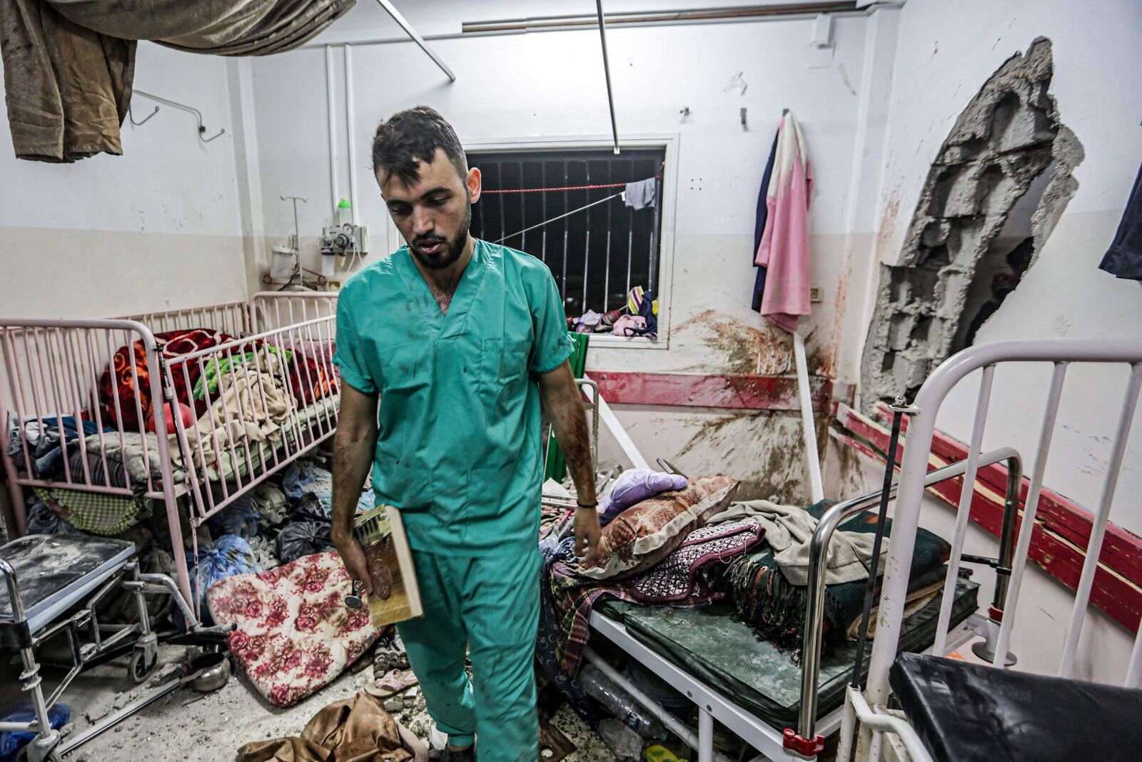 gaza war: 100 people killed in israeli strikes overnight as fears grow for patients in raided hospital