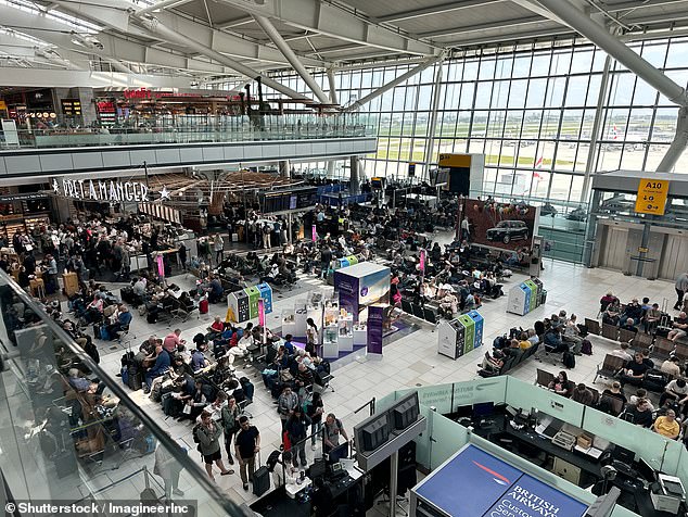 heathrow baggage handler is rushed to hospital in a critical condition after her scarf got trapped in a conveyor belt and was dragged along
