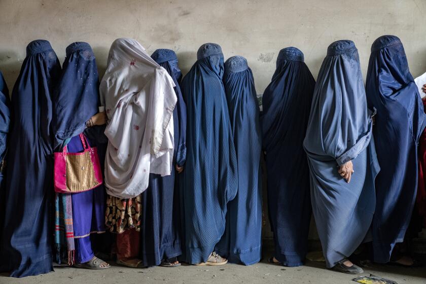 taliban decrees on clothing and male guardians leave afghan women scared to go out alone, u.n. says