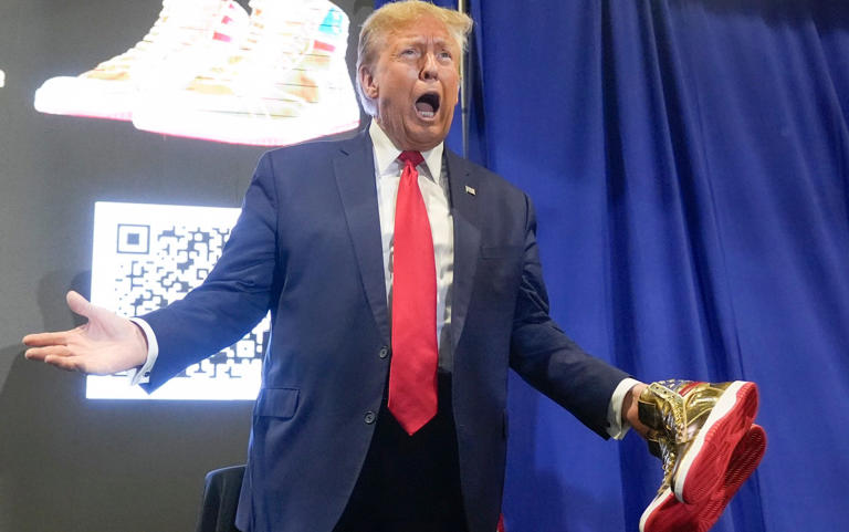 Donald Trump booed as he unveils $399 golden trainers