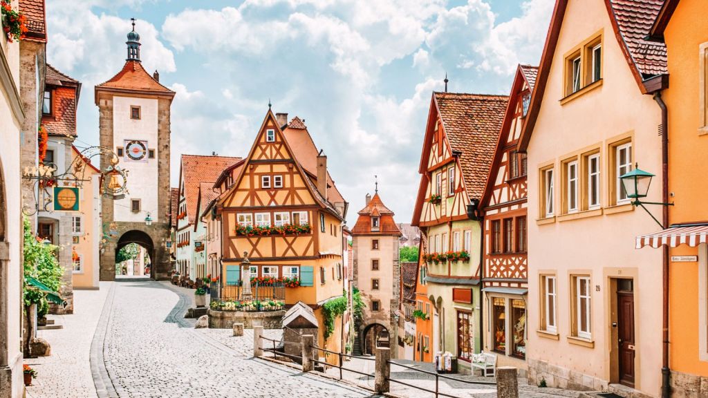 <p>In a country packed with fairytale settings, the German town of Rothenburg ob der Tauber still stands out. It’s got the lot – half-timbered buildings, medieval walls, and convivial cafes lining the central square. Don’t miss the medieval Ratstrinkstube here, and make sure you head to Plönlein, too, for a Disney-esque setting complete with a tinkling fountain, timber-framed homes, and flower-filled window boxes. </p><p class="has-text-align-center has-medium-font-size">Read also: <a href="https://worldwildschooling.com/european-cities-with-stunning-architecture/">European Cities with Impressive Architecture</a></p>