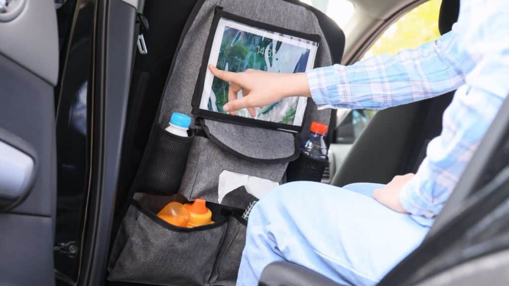 <p>One of the top comments on Reddit told parents to buy a headrest stand for their children. According to one Redditor, headrest stands can be bought on Amazon and hung on the back of your car seats.</p><p>The same person told Reddit this item comes in useful because each kid has a device they can use to stay occupied and let you focus on the road. He also recommended purchasing Bluetooth headphones so the whole car doesn’t have to listen to whatever is on the screen.</p>