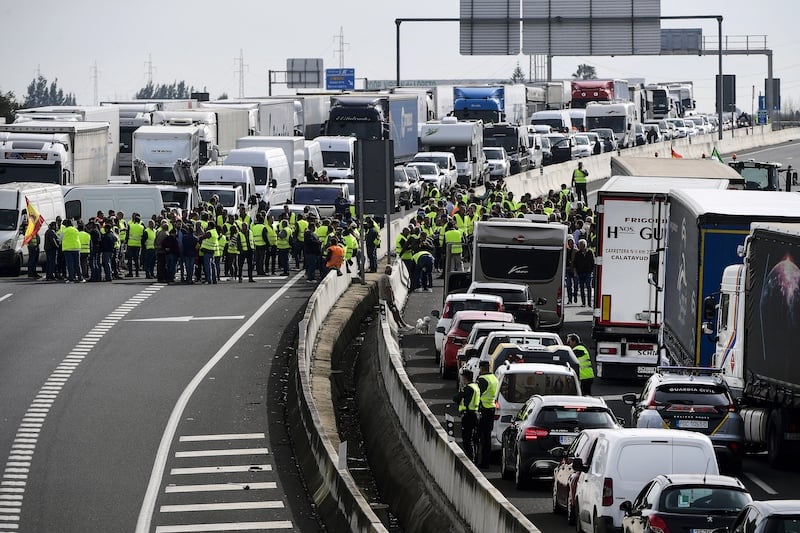 spanish farmers block motorway, seize moroccan trucks in protest