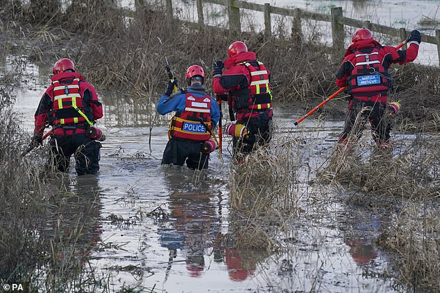 police hunt dog walker who may have seen boy, two, fall into the river soar - as specialist divers search through the night for the missing toddler