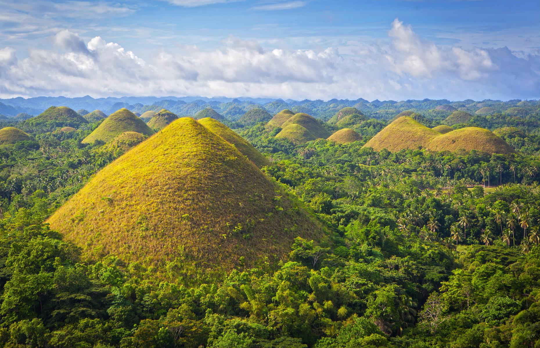 <p>The Philippines' conical Chocolate Hills – some of which soar to 394 feet (120m) – are another natural wonder often explained by magic. One legend involves a pair of squabbling giants, who launched mud and boulders at one another until they were exhausted. Their tiredness led them to forget their bickering and the havoc they'd wrought too. They left behind the towering Chocolate Hills and wandered off into the sunset. Another story claims the hills are the dried tears of an amorous giant, who was mourning the death of his mortal love.</p>