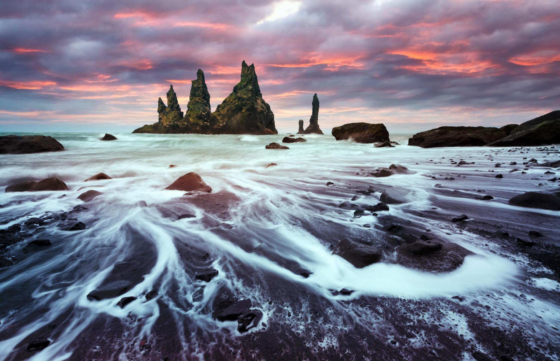 <p>Rising out from the ocean, close to the tiny village of Vík í Mýrdal, are the Reynisdrangar – three mighty basalt sea cliffs soaring to 217 feet (66m). According to Icelandic folklore, these jagged rocks are actually the remains of a fated group of trolls. It's said that the troublesome trolls caught sight of a ship out at sea and decided to pull it to shore under the cover of darkness. However, their dastardly deed took too long. Dawn broke and the trolls were immediately turned to stone. They remain a favored subject for roving photographers. </p>  <p><strong>Liked this? Click on the Follow button above for more great stories from loveEXPLORING</strong></p>  <p><strong><a href="https://www.loveexploring.com/galleries/89068/the-most-mysterious-places-on-earth">Now delve into the most mysterious places on Earth</a></strong></p>