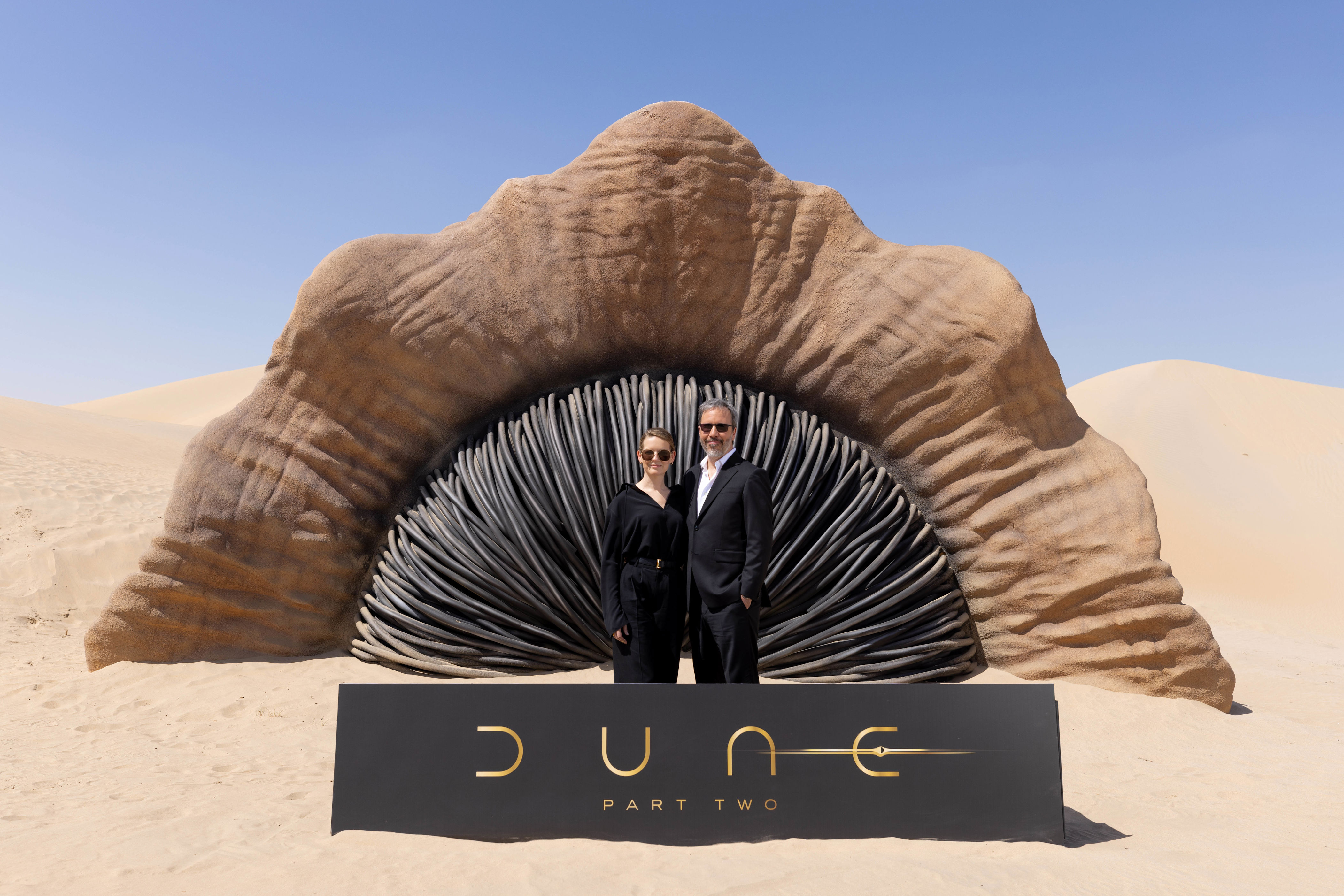 filmmaker and stars of dune: part two spotted with huge sandworm in abu dhabi's liwa desert
