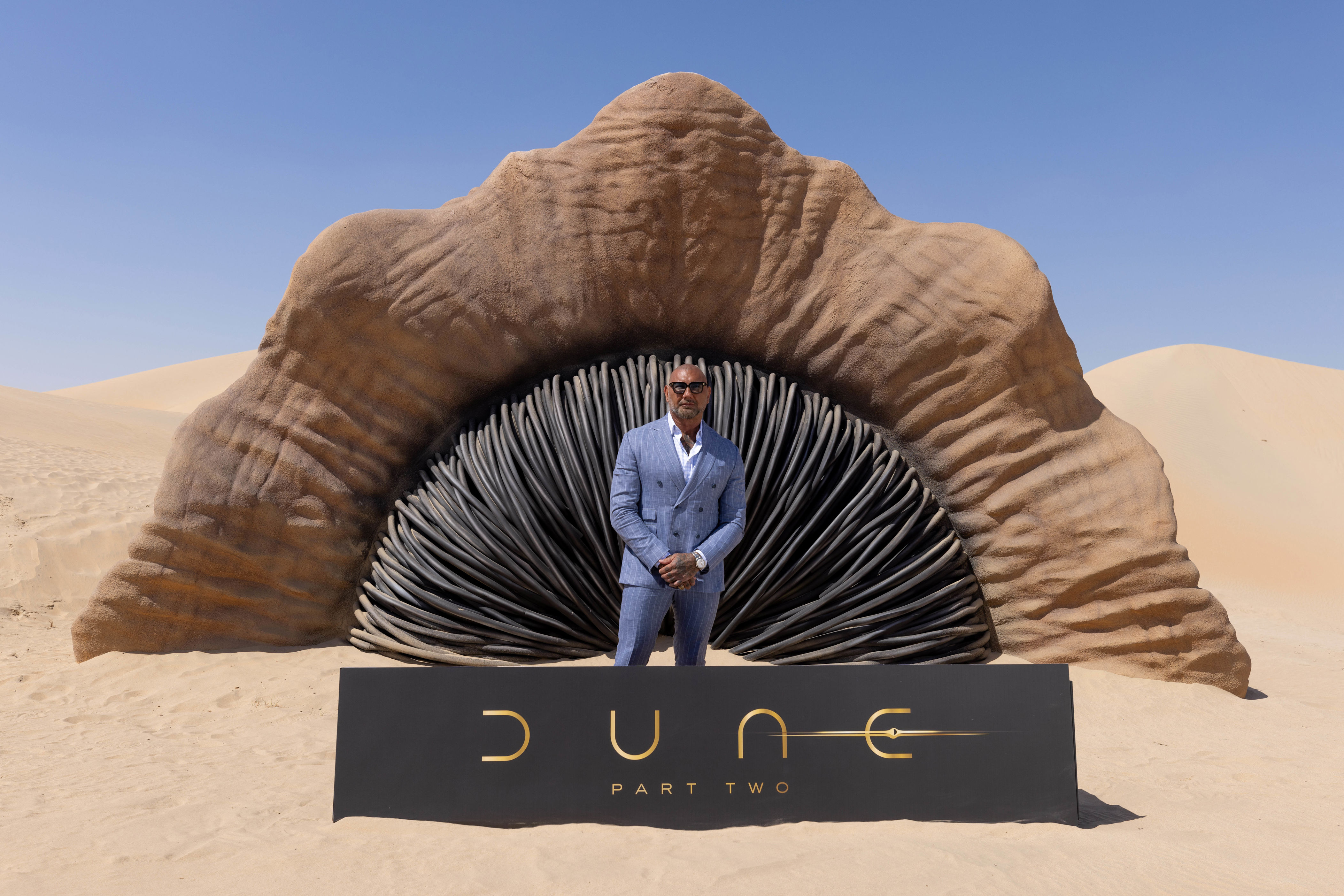 filmmaker and stars of dune: part two spotted with huge sandworm in abu dhabi's liwa desert