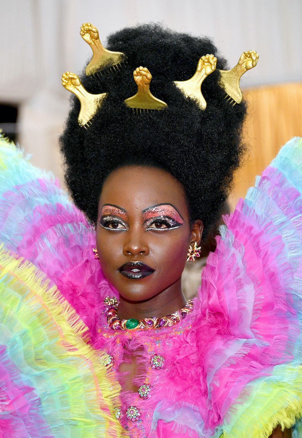 <p>                     This look on Lupita Nyong'o is such a memorable make-up look from the Met Gala red carpet, worn to the 2019 event, featuring dark glossy lips and layers of glitter taken all the way up to her brows. It's proof that at this event, more is definitely more.                   </p>
