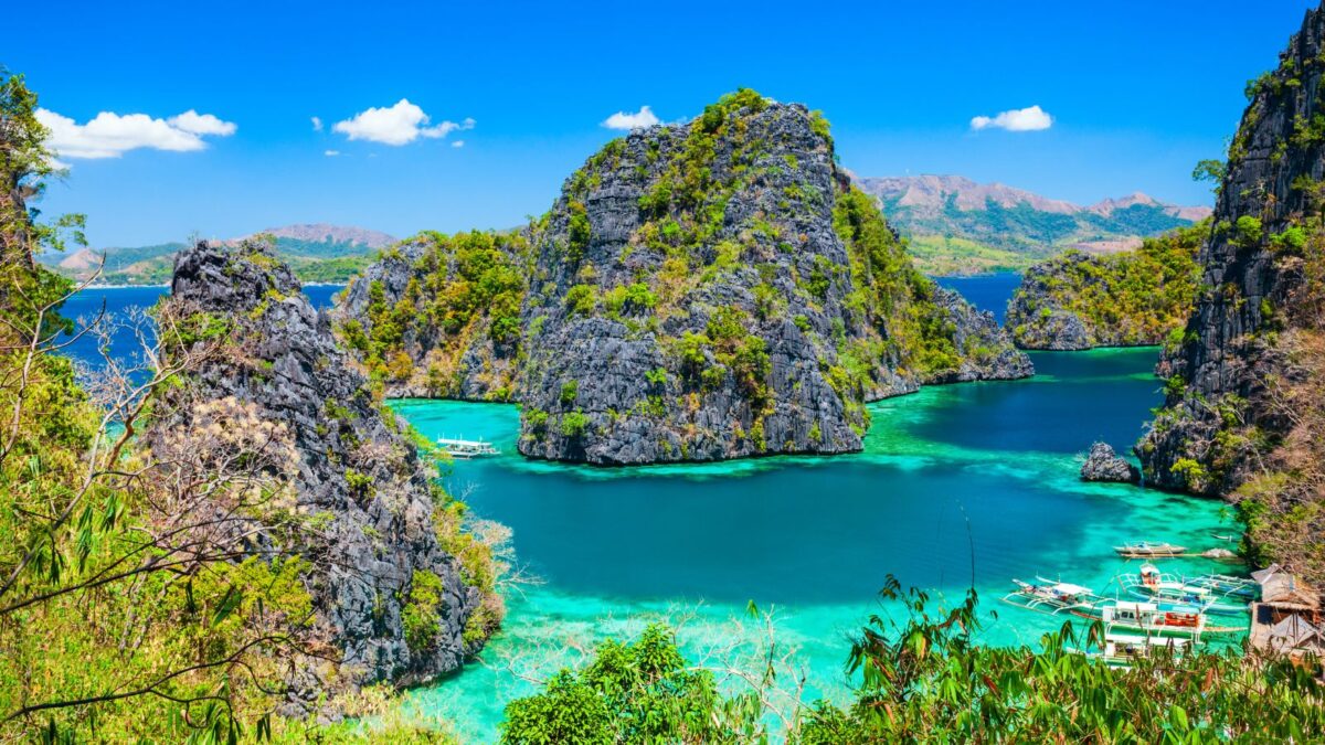<p>This idyllic island in the province of Palawan is renowned for its remarkable World War II-era wreck diving, majestic limestone landscapes, and crystal-clear freshwater lakes. Offering a quieter, more intimate setting than the lively El Nido, Coron is a top choice for honeymooners and couples seeking a serene getaway.</p><p>Swimming in the clear waters of Kayangan Lake, encircled by dramatic limestone cliffs, or snorkeling through vibrant coral reefs are just a few ways couples can spend their days. The journey to discover the mysterious underwater wrecks between Busuanga and Culion adds a unique adventure to the experience. </p><p>Beyond the water, couples can hike to a mountain peak for a breathtaking sunset or relax in a soothing hot spring. Coron’s peaceful ambiance and many activities make it an ideal setting for couples to create fun and unforgettable moments amid nature’s stunning beauty.</p>