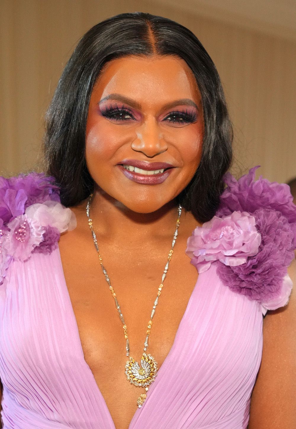 <p>                     Another brilliant case for the versatility of the purple palette, we love how the shades of Mindy Kaling's make-up perfectly match her dress here. The star opted for mega fluttery lashes, warm magenta eyeshadow and a frosted lip for the 2022 gala.                   </p>