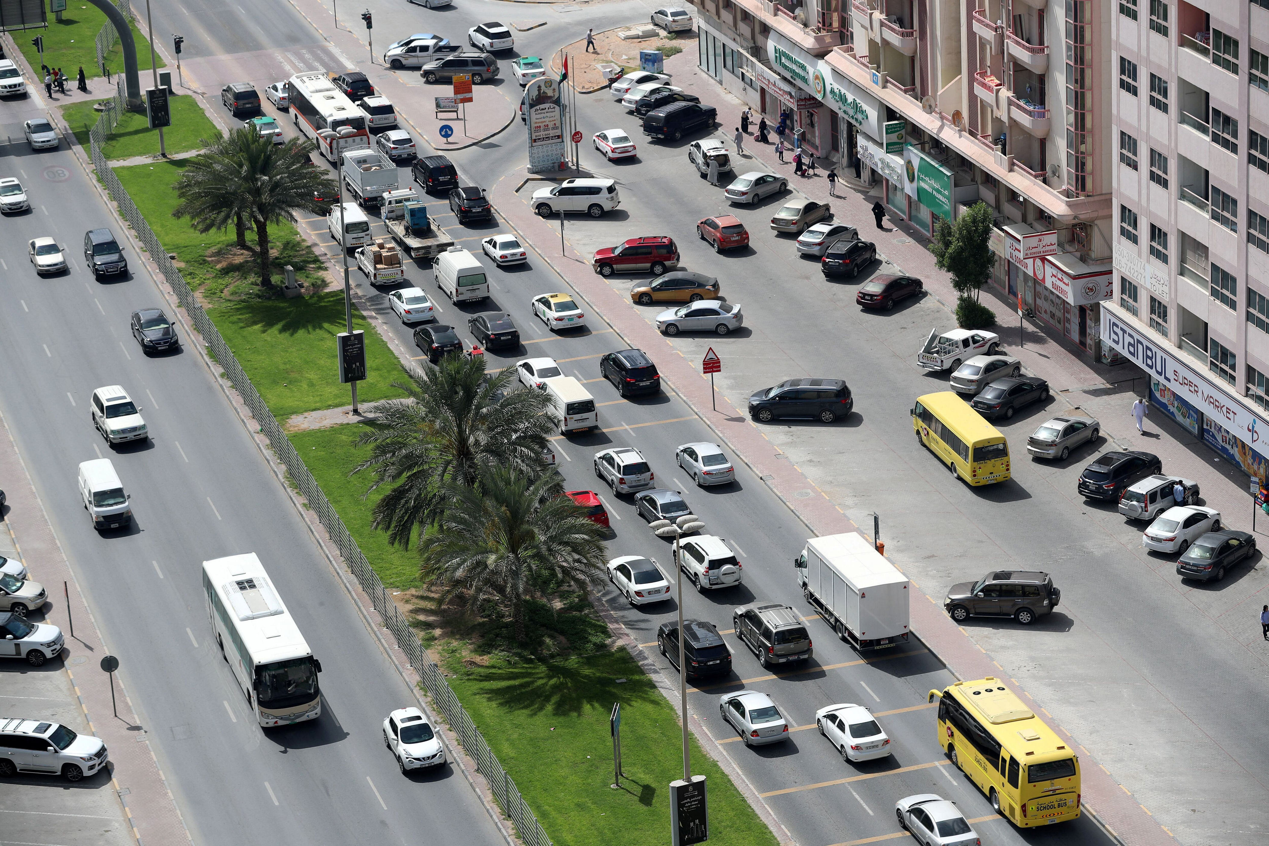 drivers in ajman urged to turn engines off at red lights to cut pollution
